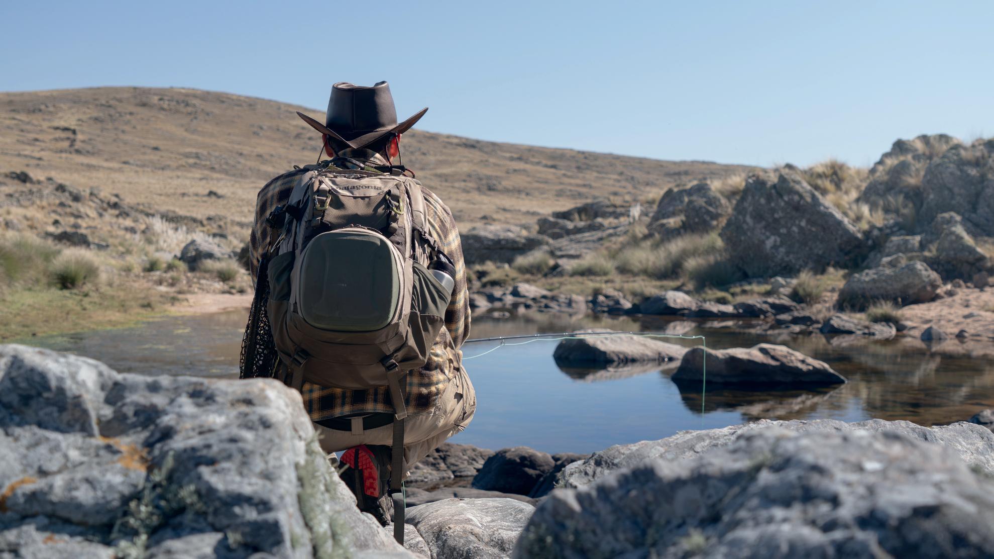 Angler looking over a mountain stream in the Sierras de Córdoba